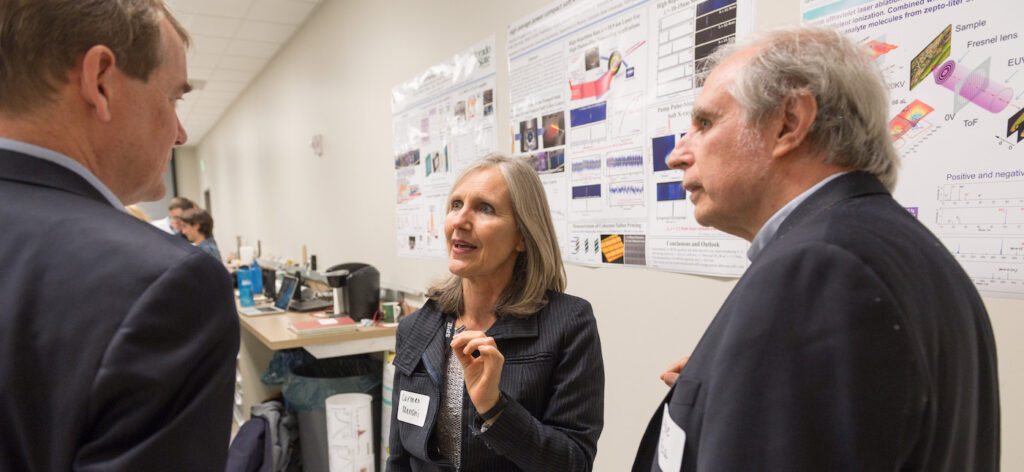 Colorado State University Electrical and Computer Engineering professors Carmen Menoni and Jorge Rocca describe to U.S. Senator Michael Bennet research being done at the Advance Beam Laboratory, May 3, 2018.